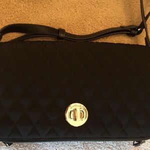 Vera Bradley NWT black quilted purse w/silver tone lock. Never used. Approx 9x6.